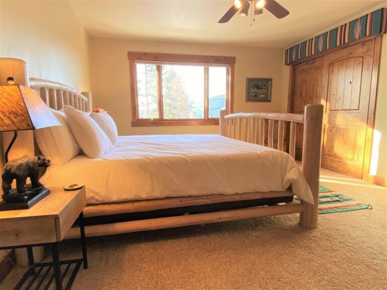 Whitefish resort town and lake vacation rental Master bed room with whitefish lake and mountain views.