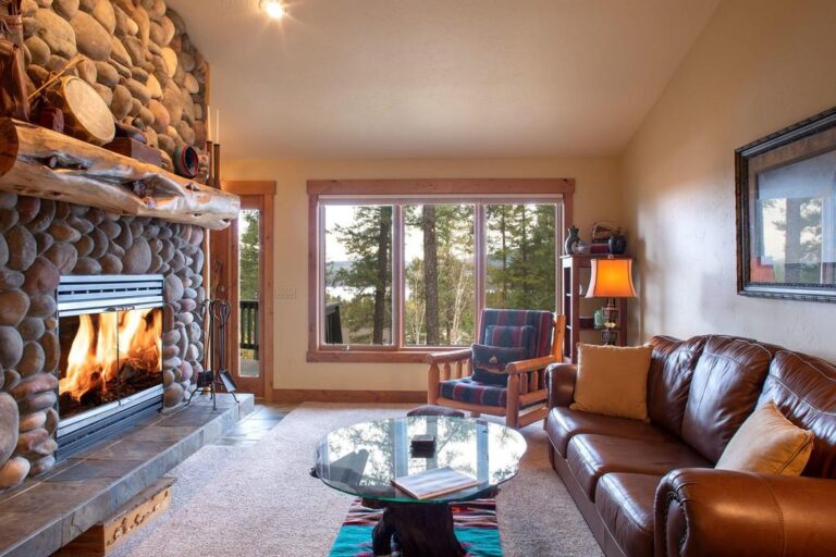 Family room with view of Whitefish lake vacation rental, fire place