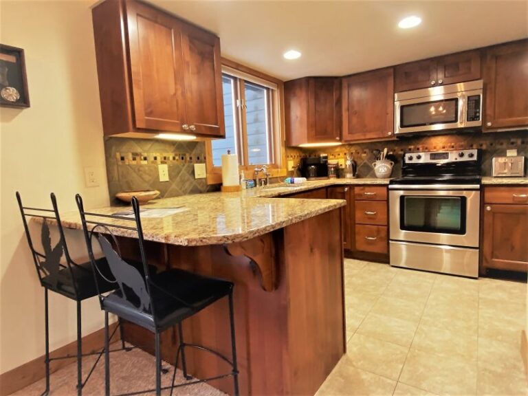 Whitefish lake vacation rental kitchen with bar stools.